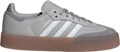 Designed with a modern twist on an iconic silhouette, these adidas Women's Sambae Shoes feature a smooth nubuck and leather upper complemented by premium embroidered 3-Stripes. Subtle details such as a stitch-and-turn toe cap and a translucent gum rubber outsole add both style and functionality. Perfect for casual wear, these shoes offer a comfortable fit with a lace-up closure, making them an ideal addition to any wardrobe. Design: These Sambae shoes add a modern twist to the iconic design of t Samba Shoes, Adidas Country, Football Shoes, Womens Athletic Shoes, Iconic Design, Wardrobe Design, Grey Adidas, Lace Closure, Athletic Women