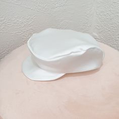 Introducing our exquisite Baby Newsboy Cap, the perfect accessory for any special event, be it a Christening, Baptism, or Blessing. This charming and sophisticated hat will make your little one look absolutely adorable and distinguished. Handmade with love, each cap is crafted from luxurious silk, one of the world's most opulent textiles. The cap not only enhances the noble and elegant nature of baptismal attire but also creates a timeless keepsake to remember this momentous occasion. ☑ Why Choo White Bonnet Gift, One Size Fits Most, White Bonnet Gift (one Size Fits Most), White Bonnet, One Size Fits Most, Gift, White Adjustable Hat For Baptism, Elegant White Flat Cap, Hat For Boys, Flat Hat, Baby Boy Baptism, Baby Blessing