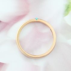 Elegant rose gold ring with tiny Turquoise gemstone. Handcrafted by jewelry designer Ascheron. If you like this ring, please add it to your favorites. Gemstone - Natural Turquoise, measuring 2mm round. Band - Measuring 2.3mm wide, dainty but strong. Metals - 14K, 18K, rose, white or yellow gold. Available in Platinum. Now also available in sterling silver. Shipping - Ships worldwide. Free shipping to US and EU. Returns - 60 days returns. Installment payments plan available. If you would like to Turquoise Wedding Ring, Gold Turquoise Ring, Wedding Ring Dainty, Turquoise Wedding Rings, Wedding Ring Rose Gold, Turquoise Gold Ring, Turquoise Wedding, Ring Turquoise, Ring Rose Gold