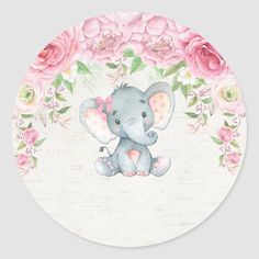 an elephant with pink flowers on it's head sitting in front of a white background