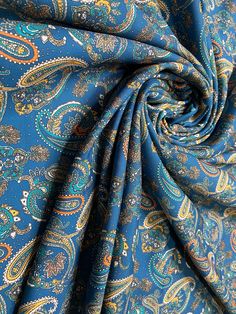 an image of a blue paisley print fabric