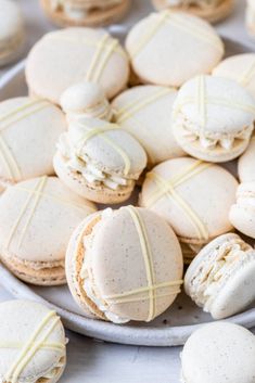 a plate filled with cookies covered in white frosting