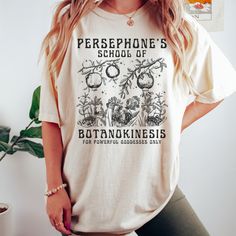 Get ready to be OBSESSED with your new Persephone Greek mythology shirt. It's the cutest and most trendy way to combine all those important trendy light academia shirt and Greek Goddess vibes! This is the perfect Greek Goddess shirt!  * Q U I C K * F A C T S * ✺  All shirts are UNISEX ✺  100%  ringspun cotton (fiber content may vary for different colors) ✺  Soft-washed, garment-dyed fabric brings extra coziness ✺  Wash and dry normally (on cool for best results) ✺  Sewn-in twill label * S I Z I N G * ✺ For an oversized fit, select two or three sizes up from your normal size ✺ Model is wearing size L  ✺ Sizing runs true to size ✺ Relaxed fit ✺ Most women find their typical size works best, since they are meant to fit a touch loose ✺ See Size guide and fit in images          * S H I P P I N Dark Academia Style Summer, Persephone Greek Mythology, Cottage Core Shirt, Persephone Goddess, Goddess Vibes, Fruit Shirt, Greek Shirts, Academia Style, Book Clothes