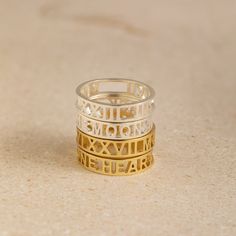 Cherish any meaningful date in your life with our intricate and unique Roman Numerals Ring. It's a great way of celebrating a deeply personal milestone through symbols that feel private to you. Material: High-Quality Solid 925 Sterling Silver Finish: Sterling Silver ∙ 18K Gold �∙ Rose Gold Dimension: 5mm height Personalized: This design can be customized with your Messages, Coordinates, Names, or Roman Numerals SKU: MM-RM03F30 Sizing Guide Rings are created true to standard US sizing. For the bes Roman Numeral Ring, Rose Gold Metal, Ring Sizer, Ring Fit, Roman Numerals, Silver Rose Gold, Silver Roses, Solid 925 Sterling Silver, Gold Rose