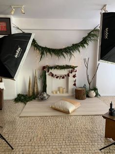 a living room decorated for christmas with lights and decorations