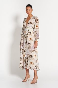 Cut in our label-exclusive Flora Print, the whimsical Capri Sheer Midi Dress is designed to elegantly shape and flatter. Comfortable and versatile, the dress is composed of a sheer georgette with features including a v-neckline, blouson sleeves, tailored torso and sculpted waistband. Model is 176cm and wears a size 8.Fits true to size. - 100% Viscose- 100% Polyester Lining- Elasticated Cuffs- Functional Self-covered Buttons- Fully Lined (ex. Sleeves) Elegant Floral Maxi Dress For Daywear, Floral Print Long Sleeve Chiffon Dress In Georgette, Spring A-line Silk Dress For Daywear, Chic Chiffon Midi Dress For Daywear, Feminine Chiffon Midi Dress For Daywear, Feminine Long Sleeve Georgette Dress, Spring Knee-length Georgette Chiffon Dress, Feminine Daywear Maxi Dress In Viscose, Chic Spring Georgette Maxi Dress