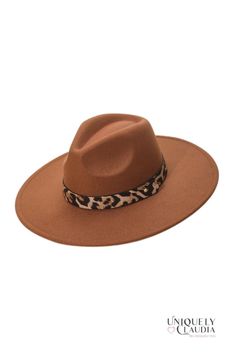 Looking for a fun and unique way to add some personality to your outfit? Check out our On the Wild Leopard Print Band Fedora Hat! This eye-catching piece is perfect for adding a touch of sass and style to any outfit. It features a vegan leopard print band with a button gold-tone accent, adjustable inner drawstring. Whether you're hitting the town or just running errands, our On the Wild Leopard Print Band Fedora Hat is sure to add some pizzazz to your fashion-savvy look. So don't wait any longer Trendy Brown Hat One Size Fits Most, Brown Curved Brim Fedora For Party, Trendy Brown Hat, One Size Fits Most, Trendy Brown Hat, Casual Fall Party Hat Bands, Brown Fedora For Beach Outing In Fall, Brown Fedora For Fall Beach Outing, Adjustable Brown Fedora For Party, Brown Wide Brim Felt Hat For Party