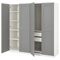 an open closet with two doors and shelves