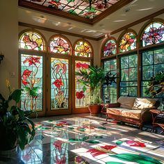 the sun shines through stained glass windows into a living room with couches and potted plants