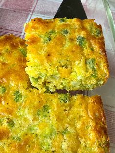 two pieces of broccoli casserole sitting on top of a glass plate