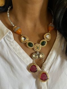 New arrivals for the festival season ♥️ The gorgeous necklace is beautifully handcrafted by our skilled Indian craftsmen in Kundan stones, beads, multi-colored stones, mini pearls, and dual tone plated. The beautiful Statement earrings add to the traditional ethnicity of the piece. Material: Brass with dual-tone plating The drop length of the necklace is 10 inches. It comes with Dori and is adjustable. The length of the earrings is 4.5 cm. The width of the earrings is 3 cm. The weight of the earrings is 24 grams per pair. This is one of a kind designer piece that will make you stand out among the crowd. Luxury Heavy Fusion Necklaces, Silver Kundan Multi-stone Necklace, Multicolor Dual-tone Fusion Jewelry, Multicolor Dual-tone Temple Jewelry, Fusion Dual-tone Necklaces For Festivals, Dual-tone Fusion Necklaces For Festivals, Multicolor Temple Jewelry, Festive Temple Jewelry Necklaces With Stones, Multicolor Fusion Necklace For Gift