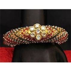 Gold Rodium Polish Multicolor color Bracelet in Metal Alloy studded with CZ Diamond Multicolor Festive Bracelet Jewelry, Festive Metal Jeweled Bracelets, Festive Jeweled Metal Bracelets, Festival Jeweled Bracelet, Festive Round Metal Bracelets, Festive Metal Bracelets For Parties, Multicolor Jeweled Bangle, Multicolor Bangle For Festive Occasions, Elegant Multicolor Metal Cuff Bracelet