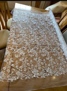 Beautiful,  white floral bridal lace with a scalloped edge. Amazing floral pattern with clear sequins for the shine, it is on a white net . This is the 4th design out of 11 that I have . It is 130 cm width please  note this is cut by meter (39") if you order 3m it will come in a continuous length! if you need a custom amount like a half a meter. please message me and we can work out a price White Scalloped Lace Dress For Bridesmaid, White Lace Bridesmaid Dress With Scalloped Lace, White Scalloped Lace Dress For Wedding Night, Lace Wedding Dress With Lace Back, Wedding Night Lace Dress With Lace Back, White Lace Dress For Bridal Shower, Bridesmaid Wedding Dress With Lace Trim, Lace Wedding Dress For Mother Of The Bride, Elegant Lace Wedding Dress For Bridal Shower