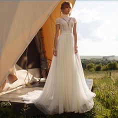 a woman standing in front of a tent