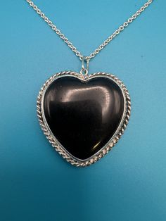 About 1.25"x1.25" silver heart necklace. Handmade in USA.  Chain 16"-18" adjustable. Since the pendant is handcrafted from sterling silver, it's resistant to all usual environmental factors and it doesn't cause any allergies or skin irritation. It may tarnish and darken with time, same as all silver jewelry but if you don't like this antique look of silver, you can easily polish it back into a mirror finish. Heart-shaped Sterling Silver Gemstone Necklace, Sterling Silver Heart-shaped Gemstone Necklace, Silver Gemstone Heart Pendant Necklace, Silver Open Heart Gemstone Necklace, Silver Double Heart Gemstone Necklace, Silver Gemstone Double Heart Necklace, Silver Heart Jewelry With Large Pendant, Sterling Silver Heart Necklace With Gemstone, Sterling Silver Heart Pendant Necklace With Heart Beads