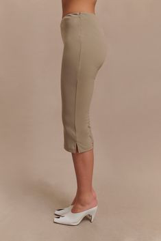 Low-key days out.The LAYLA Flared Crepe Capri Pants are a chic and versatile piece, perfect for elevating your wardrobe. These high-waisted pants feature a flattering mid-calf length and a stylish flared hem shape. The side zip and hook & eye closure ensure a sleek and secure fit, while the stretch fabrication offers comfort and ease of movement. Unlined for a lightweight feel, these pants pair perfectly with the Antonia Strapless Cut Out Top, creating a sophisticated and effortlessly stylish en Micro-elastic High-waist Pants For Pilates, Moisture-wicking Fitted Yoga Capris, Green Stretch Capri-length Pants, Fitted Capri-length Yoga Pants, High Stretch Moisture-wicking Capri Leggings, Capsule Wardrobe Accessories, Capsule Wardrobe Basics, European Summer Outfits, Wardrobe Accessories