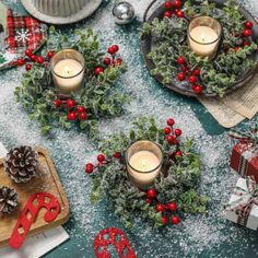 christmas decorations and candles on a table