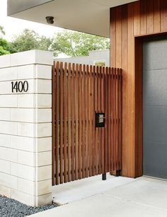 an entrance to a building with wooden slats on the front door and side wall