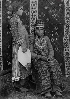 an old photo of two women in native clothing