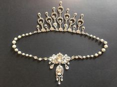 Perfect for all bridal or party to wear!!Victorian shaped shoulder necklace featuring sparkle pendants (front and back) and linked to various size of pearls on both sides. Both sides are so pretty and you can wear either side as front.Color: clear rhinestone crystals and pearls Size: necklace measures around 30.1" long, front pendant around 3.1" long x 4" drop and back dangly teardrop around 8.25" long x center 5.1" dropItem ship out with tracking number to you (around 10 to 14 business days for Wedding Cubic Zirconia Jeweled Jewelry Set, Elegant Jeweled Necklaces For Weddings, Elegant Crystal Bridal Necklace, White Jeweled Bridal Necklace For Wedding, Wedding Crystal Jewelry Sets With Bling, Crystal Bling Jewelry Sets For Wedding, Bling Crystal Jewelry Sets For Wedding, Elegant Bridal Necklace With Rhinestones For Wedding, White Crystal Rhinestone Necklace For Wedding