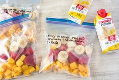 two bags of fruit are sitting on the table