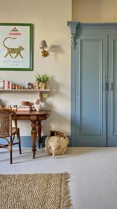 a room with blue painted walls and furniture