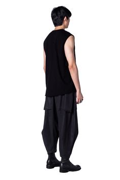 Designed as an update to the basic tank, PROCTOR updates it with circular wrapped layers, giving natural drape to the shirt. The added layering effect gives an extra, asymmetric layering style that makes it a strong standalone piece when wearing it sans jacket. The slightly oversized sizing fits easy on the body. Not too baggy, but not slim or tight. Relaxed Fit Asymmetrical Tops For Layering, Oversized Sleeveless Tops For Layering, Layered Fashion, Basic Tank, Wrinkles, Mens Jeans, Fitness Models, Tights, Women Jeans