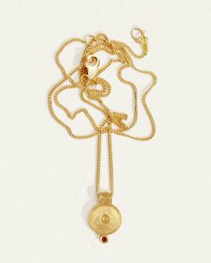 The Argos Necklace has an 18k gold vermeil coin pendant inspired by ancient libation bowls & fine curb chain. Shop ruby necklace honouring self-care. Yellow Gold Charm Necklace With Oval Coin Pendant, Yellow Gold Medallion Necklace With Delicate Pendant, Yellow Gold Oval Pendant Charm Necklace, Recycled Gold Medallion Necklace With Coin Pendant, Spiritual Yellow Gold Medallion Necklace With Large Pendant, Hammered Brass Coin Pendant Necklace, Brass Medallion Necklace With Coin Pendant, Brass Amulet Style Coin Necklace, Brass Coin Pendant Necklace In Medallion Shape