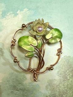 "Thank you for viewing Wrenn Estate. Wonderful Krementz brooch with a lotus flower and lily pads in glowing green enamels. The center of the lotus flower is a cultured pearl. This would be easy to run a chain through and wear as pendant. Also could be worn on ribbon as a choker. Will also look amazing on a suit jacket! 10.7 grams 14k yellow gold 5mm cultured pearl hallmarked \"14k\" and Krementz makers mark circa 1920" Lotus Brooch, Water Lily Jewelry, Lotus Flower Jewelry, Hair Brooch, Lotus Jewelry, Brooch Flower, Art Nouveau Jewelry, Bow Earrings, Gold Enamel