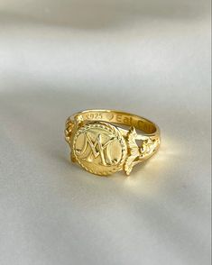 The Marie Antoinette Ring her monogrammed rIng MA, she was the queen of France brfore the French Revolution. This beautiful ring made of 18k gold plated silver and inscribed inside Eat Cake. Gold Oval Initial Ring Stamped 14k, Luxury Gold Engraved Ring, Promise Ring With Initials In 14k Gold, Gold Sterling Silver Engraved Open Ring, Gold-color Open Ring Engraved Sterling Silver, Gold-color Sterling Silver Engraved Open Ring, Gold-colored Sterling Silver Engraved Open Ring, Luxury White Gold Initial Ring, White Gold Monogram Rings For Wedding