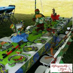 the table is set up with many items for children's birthdays and parties