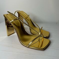 In Gold Metallic Only Flaw Is Shown In Pic But When Worn It Isn’t Really Visible, They’re Stunning When Worn They Haven’t Been Worn As You Can See Just Tried On $295 Through Lg @Relove.Rgv (Sp1) Gold Heels With Heel Loop For Formal Occasions, Chic Metallic Heels With Heel Loop, Luxury Gold Heels With Heel Loop, Sleek Gold Sandals For Evening, Sleek Gold Evening Sandals, Modern Gold Open Heel Heels, Gold Heels With 4-inch Heel For Event, Sleek Gold Heels With Padded Heel, Modern Gold Ankle Strap Heels