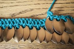 a crocheted chain with several different sized discs attached to it