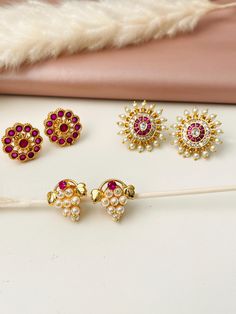 Specially for this Ganesh utsav get ready in traditional marathi jewelry . Kudi in Maharashtrian jewelry is 7 or more pearls arranged in circular flower or any natural shapes .  Bringing that authentic traditional jewelry in high quality gold plated pieces.  Draksha : means grapes 🍇. These earrings use stunning pearls , Ruby gems and high quality gold plating . This is a traditional piece .  Pearl ,CZ and Ruby gems kudi  Ruby stones fancy kudi  Get kolhapuri saaj , vajratik , khopa hair accesso Elegant Meenakari Earrings For Puja, Meenakari Earrings For Puja, Round Shape, Round Meenakari Earrings For Puja, Meenakari Round Earrings For Puja, Traditional Round Earrings For Puja, Elegant Chandbali Earrings For Puja, Meenakari Earrings For Puja, Elegant Earrings For Diwali Puja, Elegant Earrings For Puja And Diwali