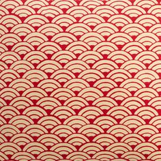 a red and white wallpaper with an intricate pattern on it's surface,