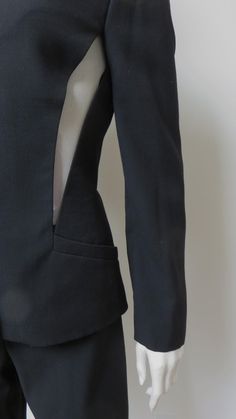 Structured Fitted Pantsuit For Party, Fitted Tuxedo Style Structured Pantsuit, Structured Tuxedo Style Fitted Pantsuit, Fitted Tuxedo-style Structured Pantsuit, Fitted Office Pantsuit With Structured Boning, Sleek Fitted Pantsuit With Structured Boning, Fitted Structured Tuxedo Suit, Modern Fitted Long Sleeve Pantsuit, Modern Fitted Pantsuit With Long Sleeves