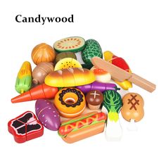 a pile of toys sitting on top of a white surface with words candywood above it