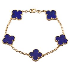 This rare Van Cleef & Arpels bracelet from the classic Vintage Alhambra collection is crafted in 18k yellow gold and features 5 lucky clover motifs inlaid with blue lapiz lazuli in round bead settings. Made in France circa 1980s. Measurements: 0.59" (15mm) width, 7.5" (19.5cm) length. Excellent condition. Comes with original pouch and VCA service receipt. Van Cleef Navy Blue, Blue Van Cleef Bracelet, Blue Van Cleef, Van Cleef Jewelry, Van Cleef Arpels Bracelet, Van Cleef Bracelet, Braclets Gold, Navy Blue Vans, Van Cleef Necklace