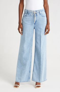 A tie at the high waist adds weekend-ready style to full-length, casual-chic wide-leg jeans made from soft, nicely draped nonstretch denim. 30 1/2" inseam; 22" leg opening; 11 1/2" front rise; 16" back rise (size 29) Tie waist Five-pocket style 60% cotton, 40% lyocell Machine wash, tumble dry Imported