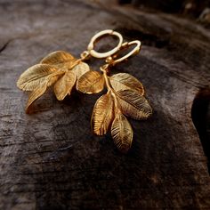 Gold plated Woodlands Leaf Hoops Earrings Gold Plated Brass/Silver Plated Brass Transform your Autumn in a magic experience with these Woodland Leaf hoops Earrings, made of 14k gold plated brass. The leaves are matte gold plated. Lightweight and comfortable, easy to wear and dainty, these earrings are the perfect addition for your autumn vibes! Also available in silver plated brass, with 925 Sterling Silver Hoops. DETAILS: - color: gold - material: 14k gold plated brass - leaf size: 31 mm - tota Gold Leaf-shaped Single Earring, Gold Single Leaf-shaped Earring, Gold-plated Leaf-shaped Earrings, Leaf-shaped Single Earring As A Gift, Gold Leaf-shaped Jewelry For Jewelry Making, Leaf-shaped Yellow Gold Brass Jewelry, Leaf-shaped Brass Earrings For Gift, Leaf-shaped Brass Earrings As Gift, Gold Plated Leaf-shaped Jewelry