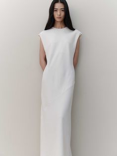 Editor's NotesThe garment is a long dress that exudes understated elegance, perfect for showcasing grace and sophistication. Its back is adorned with subtle shirring, adding a touch of allure and refinement.- The dress's length gracefully covers the body, offering a flattering silhouette.- Crafted with a minimalist design, this piece highlights a sleek and streamlined form.- The long cut of the dress is designed to elongate the figure, providing an elegant and statuesque appearance.Measurements(in.)Size: One Size (XS-M)- Chest: 19.29- Shoulder: 19.69- Total Length: 52.36* Model Tian Liao Info: Height 5'61024 Bust 29.9213 Waist 26.378  Hips 33.8583Composition & Care- 100% Polyester- Cleaning Recommendation: Dry Cleaning Recommended- If washing with water, it is recommended to Formal White Midi Dress With Pleated Back, Elegant Daywear Dresses With Side Slits, Elegant Bias Cut Maxi Dress For Daywear, Elegant White Maxi Dress With Pleated Back, White Workwear Dress With Pleated Back, White Pleated Back Dress For Work, White Dress With Pleated Back For Work, White Formal Maxi Dress With Side Slits, Elegant Bias Cut Dress For Daywear