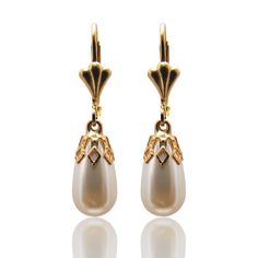 "TearDrop Pearl earrings, vintage inspired for brides or bridesmaids.  Delicate white pearl drop capped with a gold vintage style element. This design has been made with CRYSTALLIZED™ - Swarovski white/ivory Pearls and 24 KT gold plated or silver elements. Earrings length: 0.8\" / 2 cm approx. Complete your look with a Matching necklace: https://www.etsy.com/il-en/listing/129445188/pearl-drop-necklace-gold-plated-and?ref=shop_home_active Follow me on Facebook: https://www.facebook.com/YaelBelDes Elegant Pearl White Dangle Chandelier Earrings, Elegant Pearl Chandelier Earrings, Elegant Pearl White Pearl Chandelier Earrings, Elegant Pearl White Chandelier Earrings With Pearl Drop, Elegant Pearl White Chandelier Earrings, Elegant Chandelier Earrings With Pearl Charm, Classic Pearl Bridal Earrings For Evening, Victorian Teardrop Pearl Drop Earrings, Vintage French Hook Earrings For Wedding