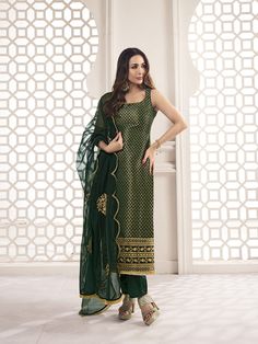 This great winter ensemble from Malaika Arora is perfect for your next special occasion. It includes a bottle green kurta set crafted from silk blend brocade, cotton and organza. Featuring Zari woven designs, a U-neck and calf length trousers, this set is sure to make a statement. It is dry clean only and designed specifically by the Bollywood Diva herself. TOP: Silk Blend(Brocade), TOP INNER: Cotton, BOTTOM: Cotton, DUPATTA: Organza, Dry Clean Cotton Suit Designs Sleeveless, Green Suit Designs Indian Style, Short Kurta Suits Women, Bottle Green Suits Women Indian, Brocade Kurta Set, Green Kurta Set Women, Kurta Designs Women Sleeveless, Trendy Suit Designs For Women, Blouse Back Ideas