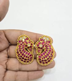 Pure Silver Jadau Kundan Ambi shape Stud Earrings made in 92.5 real silver with 22ct gold plating. Product comes with 92.5 silver hallmark.  92.5 Pure Silver Fusion Jewelry, Silver kundan earrings, Dual Tone Jewelry with Kundan  Antique Gold Plated 92.5 Pure Silver Channel Setting Ruby Kundan Silver Polki Earrings We try to do our best to represent the item's true colour in the pictures, but colors may vary slightly due to differences in individual phone settings. - If any product is not ready, It takes 2-3 weeks to make in pure silver Important Note: We need proof of video while the package is opened for considering any case of missing or damaged products ; NO EXCEPTIONS PLS.. We can not accept any returns, if video at the time of package opening is not provided by the client. Videos afte Dual-tone Temple Jewelry Earrings For Puja, Festive Dual-tone Earrings For Puja, Dual-tone Kundan Temple Jewelry Earrings, Dual-tone Temple Jewelry Bridal Earrings For Diwali, Diwali Temple Jewelry Dual-tone Bridal Earrings, Diwali Dual-tone Temple Jewelry Bridal Earrings, Traditional Dual-tone Kundan Earrings, Kundan Temple Jewelry Earrings, Elegant Earrings With Stone Work For Puja