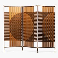 a room divider made out of wood with two circles on the top and bottom