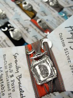 a close up of a metal object on a piece of paper with other items in the background