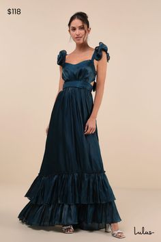 You'll turn on the wow factor every time you slip into the Lulus Pristine Glow Dark Teal Ruffled Tie-Back Maxi Dress! Shimmery woven organza shapes this stunning dress that features a lightly gathered bodice with a lovely sweetheart neckline and long sashes that secure atop an open-back design, supported by ruffle-trimmed straps. The high, banded waist tops a flowy, A-line skirt that cascades down to a tiered, ruffled maxi hem. Hidden back zipper/clasp. Fit: This garment fits true to size. Length: Floor length. Size medium measures 62.5" from shoulder to hem. Bust: Great for any cup size. Waist: Fitted - very fitted at natural waist. Hip: Not Fitted - fuller skirt allows room for hips. Undergarments: May be worn with an adhesive bra, petals, or no bra. Fabric: Fabric has no stretch. Extra- Teal Bridesmaid Dresses Long, Dark Teal Bridesmaid Dresses, Dark Teal Dress, Black Tie Dress Code, Teal Bridesmaid Dresses, Long Flowy Dress, Black And Blue Dress, Gathered Bodice, Turquoise Dress