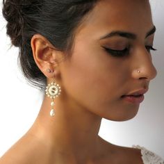 "I created this Pearl wedding earring by hand, using Swarovski Rivoli 10mm for each one, Swarovski 3-5 mm pearls, Swarovski drop pearl, Miyuki round seed beads, Miyuki Delica beads, and 14k goldfilled ear-wire Elegant, feminine and impressive * Measurements: Earring length: 2.36\" (6cm) Pendant diameter: 0.78\" (2cm) * The earrings will come beautifully packaged for a gift. * For other Bridal earrings: https://www.etsy.com/ca/shop/LioraBJewelry?ref=listing-shop2-all-items-count%C2%A7ion_id&s Long Chain Earrings Gold, Earrings Handmade Beaded, Pearl Wedding Jewelry, Pearl Wedding Earrings, Earrings For Bride, Pearl Drop Earrings Bridal, Earrings Pearl Drop, Earring Pearl, Pearl Drop Earrings Gold