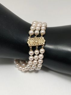 What a gorgeous pearl Vintage 14K gold cultured pearl bracelet. The length of the bracelet is 8.25 inches long and weighs 21 grams. The piece is circa the 1990s. Free shipping by USPS Priority Mail. Gold Beaded Bracelets With Pearl Charm For Formal Occasions, Classic Gold Pearl Bracelet, Gold Bracelet With Pearl Charm For Formal Occasions, Pearl Charm Gold Bracelet For Formal Occasions, Classic Pearl Gold Bracelet In Yellow Gold, Classic Gold Pearl Drop Bracelet, Formal Gold Bracelet With Pearl Charm, Formal Gold Beaded Bracelet With Pearl Charm, Formal Yellow Gold Pearl Bracelet With Pearl Drop