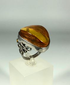 Valentines Day Perfect Gift!Discover the timeless elegance of our Spectacular Orange-Brown Amber Ring, expertly crafted for ladies in stunning 925 sterling silver. This exquisite piece features natural Baltic Sea amber, renowned for its unique beauty and healing properties. Perfect for any occasion, this amber ring will add a touch of sophistication to your jewelry collection. Product Details: Material: 925 Sterling Silver Stone: Natural Baltic Sea Amber Color: Spectacular Orange-Brown Design: M Amber Open Ring For Anniversary, Silver Cabochon Rings Fine Jewelry, Classic Amber Rings For Formal Occasions, Elegant Amber Oval Rings, Elegant Oval Amber Rings, Luxury Amber Rings For Formal Occasions, Sterling Silver Ring With Shiny Finish, White Gold Rings With Shiny Finish For Gift, Elegant Amber Cabochon Ring